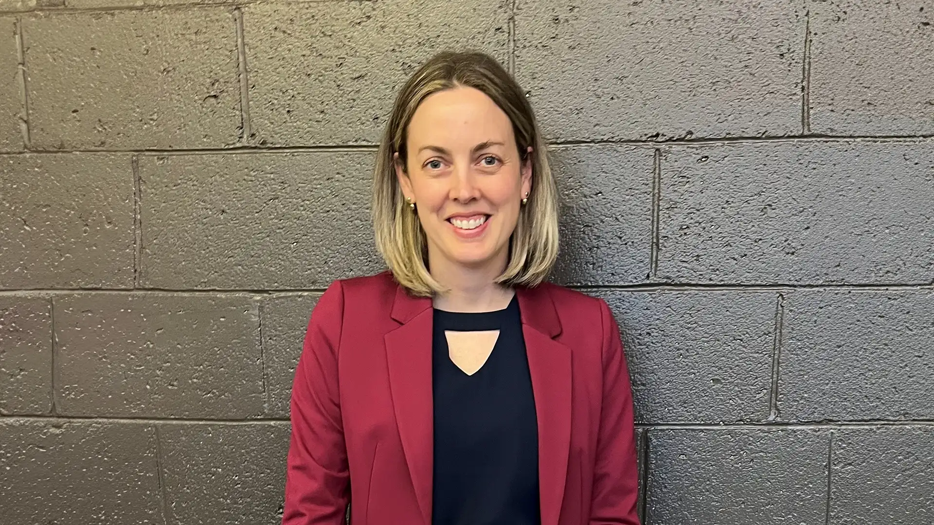 Renee Hickey portrait in front of a granite wall