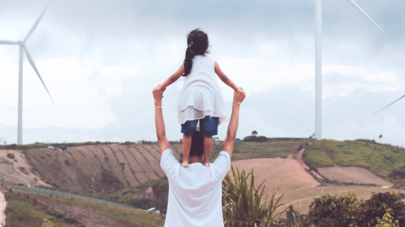 Family looking at windfarm